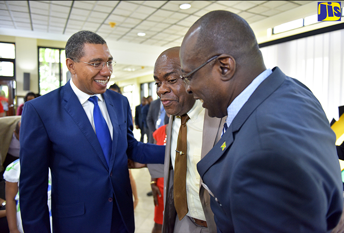 Prime Minister, the Most Hon. Andrew Holness (left), and Education, Youth and Information Minister, Senator the Hon. Ruel Reid (right), share a light moment with Opposition Senator, Dr. Floyd Morris, during Tuesday's (May 1) launch of activities for Workers' Week and Labour Day 2018. The launch took place at the Office of the Prime Minister. 