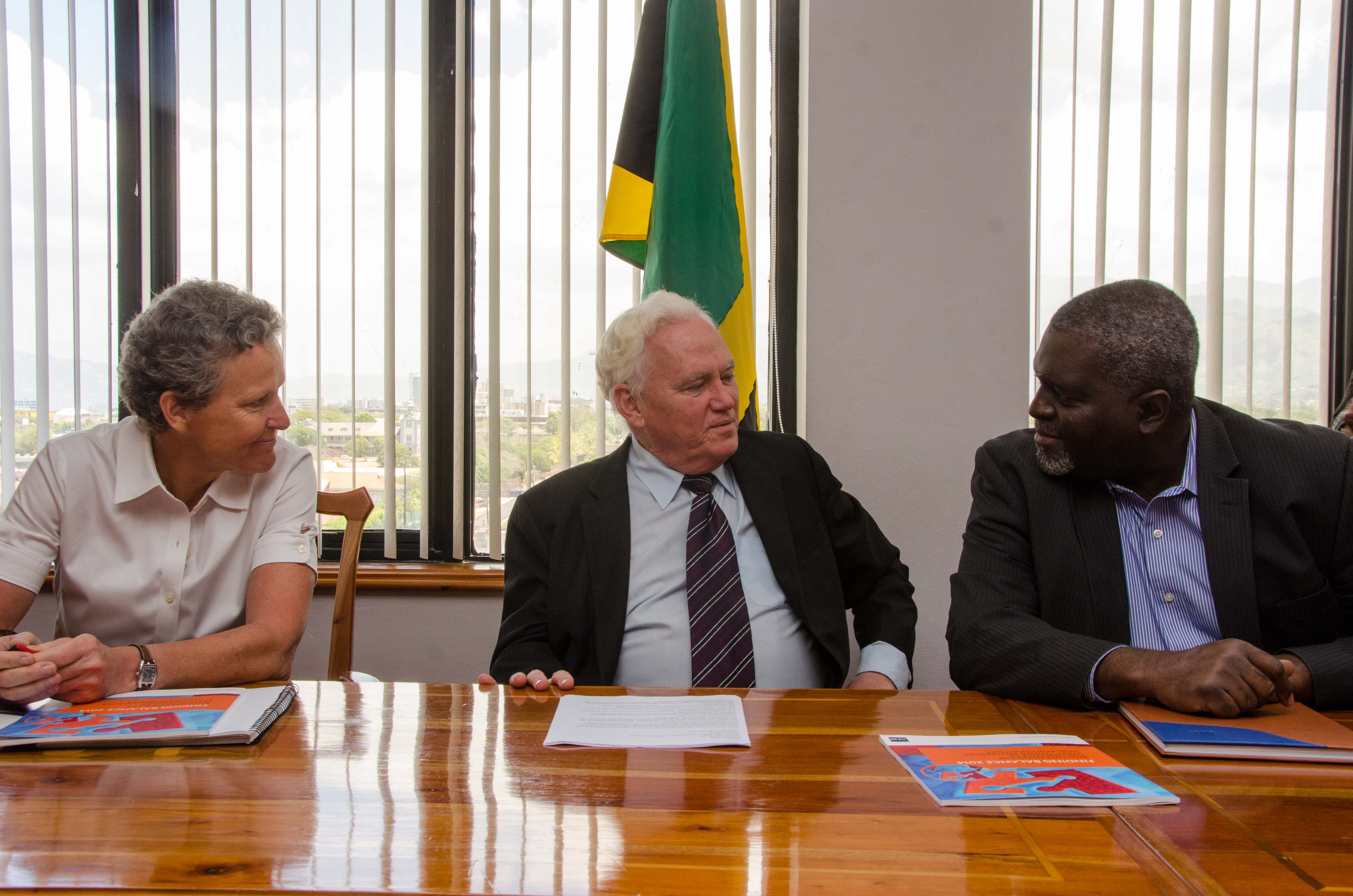 Financial Secretary in the Ministry of Finance and Planning, Devon Rowe (right),   in discussion with (from left): Asian Development Bank (ADB) Pacific Private Sector Development Specialist, Laure Darcy and former New Zealand Minister of State Owned Enterprises and author, Hon. Richard Prebble, before the start of a meeting at the Ministry’s Heroes Circle Offices, on July 23.  A delegation from the multilateral financial institution is in the island for a visit from July 20 to 23.