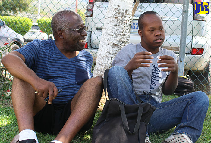 Trevor Ramikie shares a moment with his son, Zane, on the University of Technology campus.
