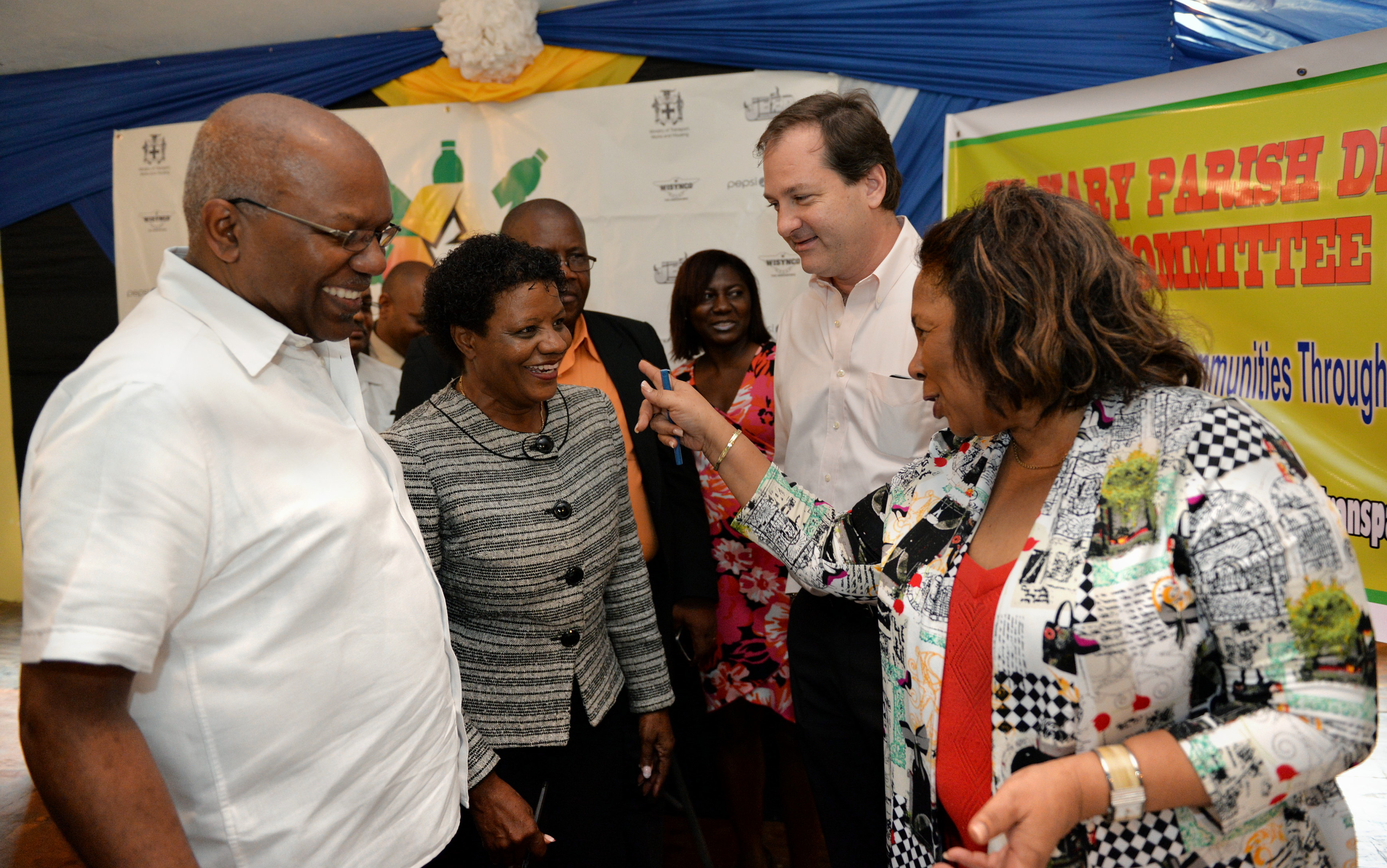 Minister  with responsibility for Housing, Hon. Dr. Morais Guy (left), observes while Chairman of Recycling Partners of Jamaica, Miss Lucille Brodber (right), makes a point to Executive Director of the National Solid Waste Management Authority (NSWMA), Miss Jennifer Edwards (2nd left). Occasion was the launch of the Government’s first recycling project at the Anglican Church, in Part Maria, St. Mary, on December 4.  At third left is Deputy Chairman of Recycling Partners of Jamaica, Francois Chalifour.