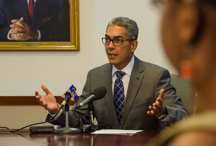 Co-Chair of the Economic Programme Oversight Committee (EPOC), Richard Byles, addressing journalists at  the monthly briefing at the Sagicor head office, in New Kingston, on August 14.