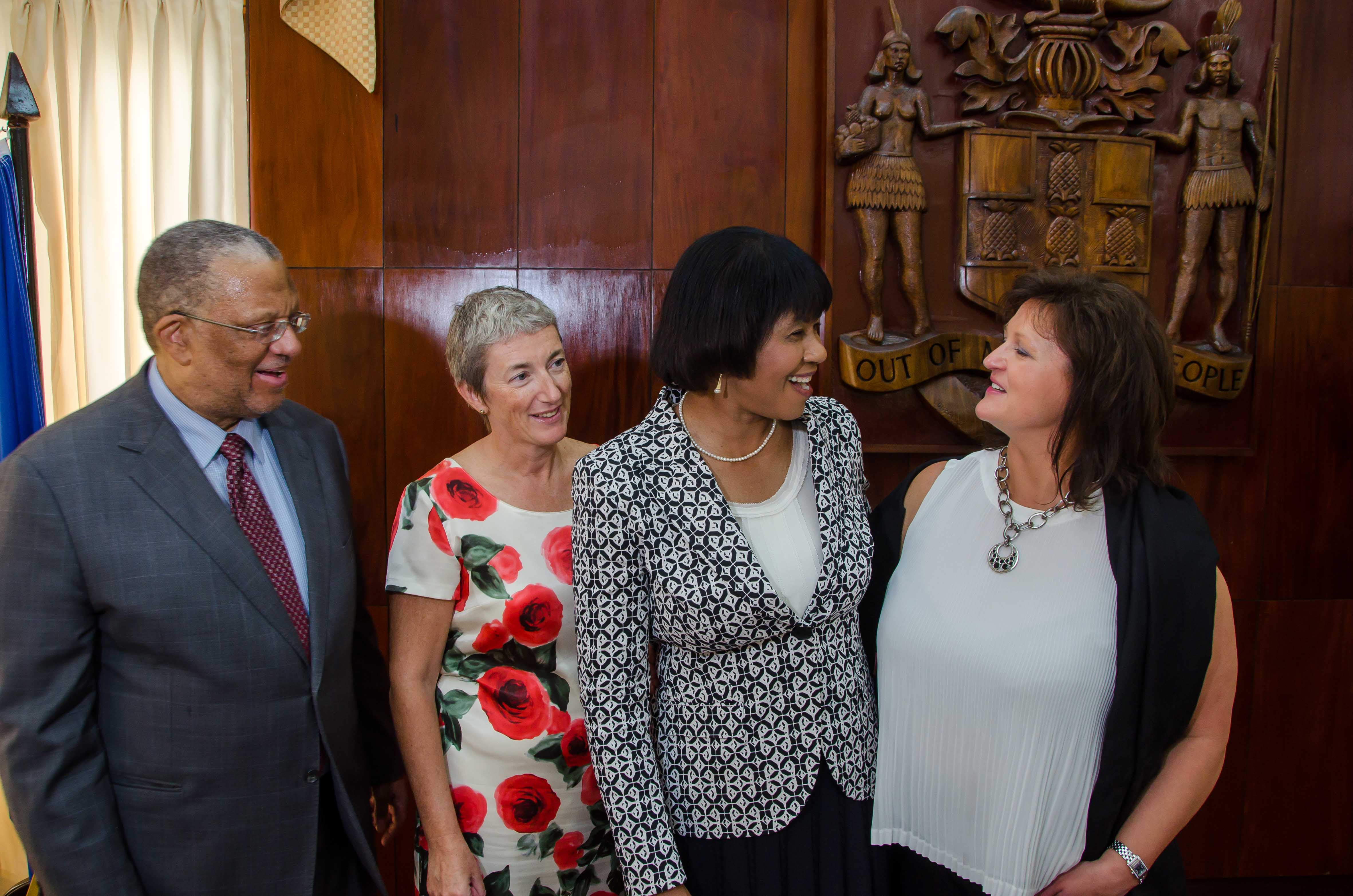 Prime Minister, the Most Hon. Portia Simpson Miller (second right), shares a light moment with European Union (EU) Director for Cooperation with Latin America and the Caribbean,  Jolita Butkeviciene (right), while Minister of Finance and Planning, Dr. the Hon. Peter Phillips; and Head of the EU Delegation to Jamaica, Ambassador Paola Amadei, look on. They were at a signing ceremony at Jamaica House on Tuesday, November 17 for the handover of two budget support payments by the EU to Jamaica totalling $2.3 billion.