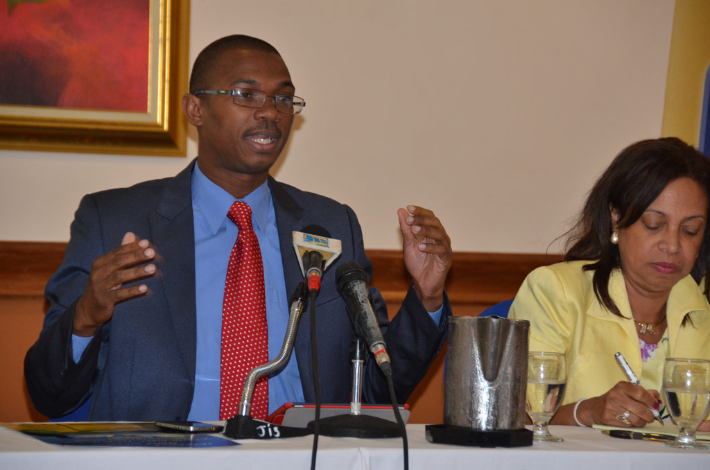 State Minister in the Ministry of Foreign Affairs and Foreign Trade, Hon. Arnaldo Brown (left), provides details about the upcoming  Biennial Jamaica Diaspora Conference at a forum held on May 27 at the Sunset Resort in Montego Bay. At right is Minister of State in the Ministry of Industry, Investment and Commerce, Hon. Sharon Ffolkes-Abrahams.

