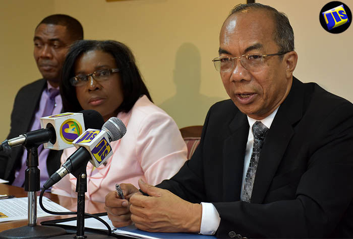 Minister without Portfolio in the Ministry of Economic Growth and Job Creation, Hon. Dr. Horace Chang (right), addresses a post-Sectoral Debate press conference on July 6 at the Ministry’s offices in New Kingston. Also at the head table are (from left) President of the National Water Commission, Mr. Mark Barnett; and Permanent Secretary, Mrs. Audrey Sewell.