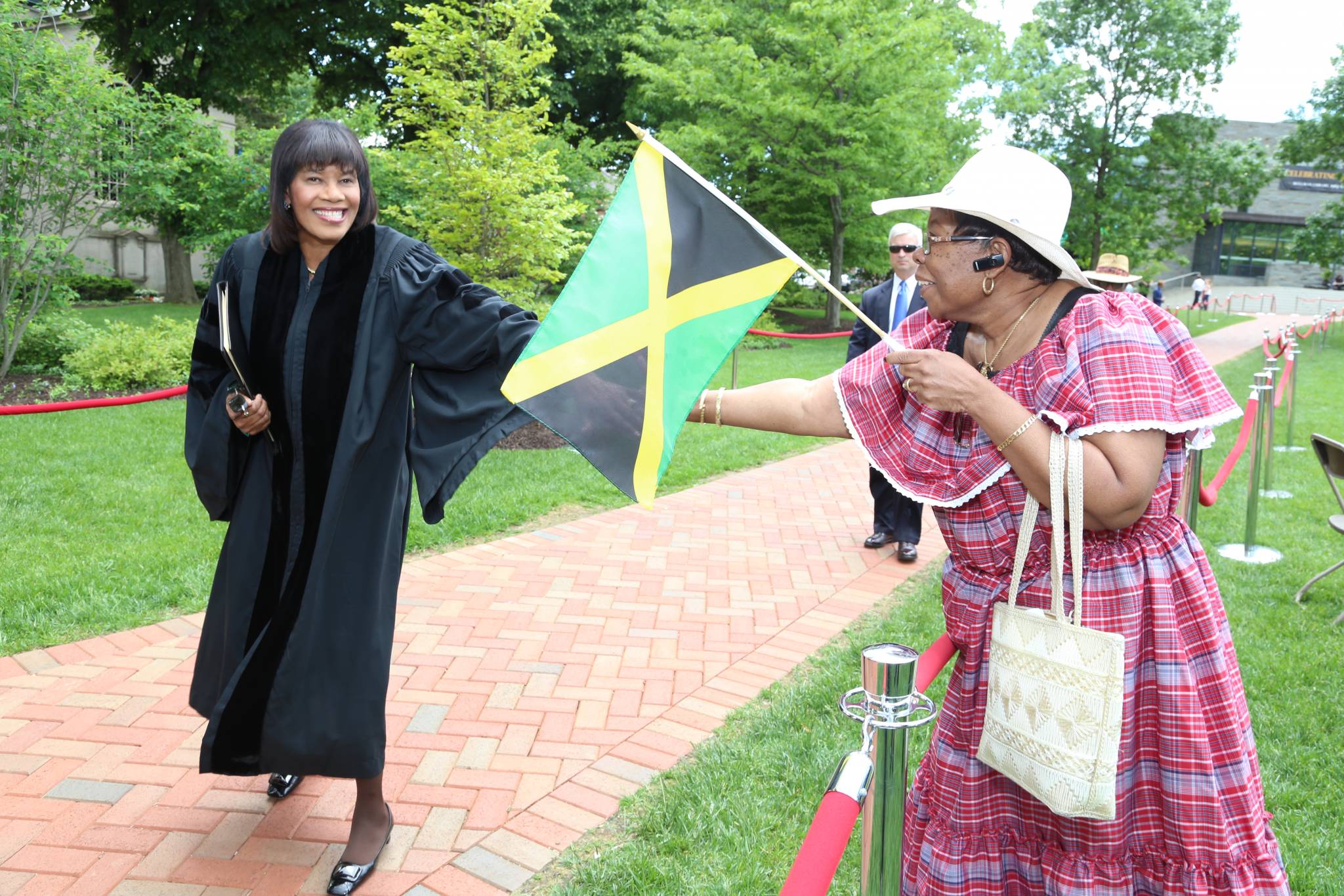 Prime Minister the Most Hon. Portia Simpson Miller greets a  member of the Jamaican Diaspora, at the historic Lafayette College in Pennsylvania, United States, on Saturday (May 24). The Prime Minister delivered the commencement address and was conferred with the Hon. Doctor of Public Service Degree.