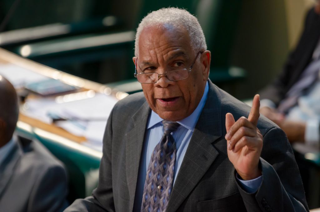Minister of Transport, Works and Housing, Dr. the Hon. Omar Davies,  addresses the House of Representatives on Tuesday (January 12).