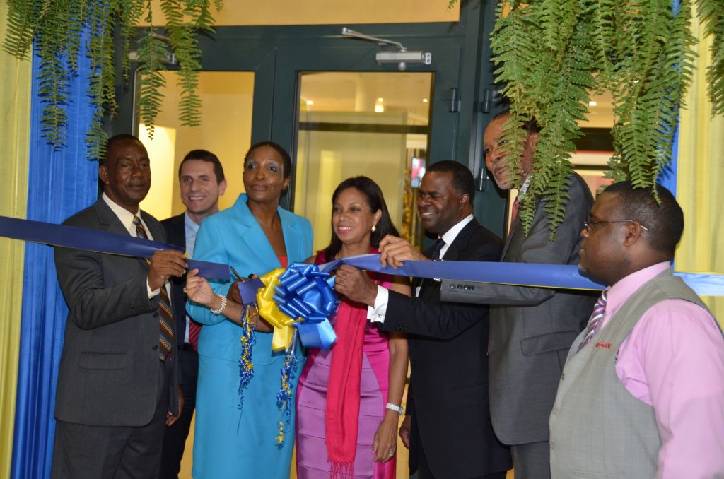 Chairman of the Montego Bay Chamber of Commerce and Industry Expo 2013, Sonia Kerr-Bowen (third left), cuts the ribbon to signal the official opening of the Chamber
