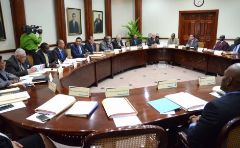 Prime Minister the Most. Hon. Andrew Holness (fifth left), addresses Members of the Cabinet at the first official meeting, today (March 15), at the Office of the Prime Minister.