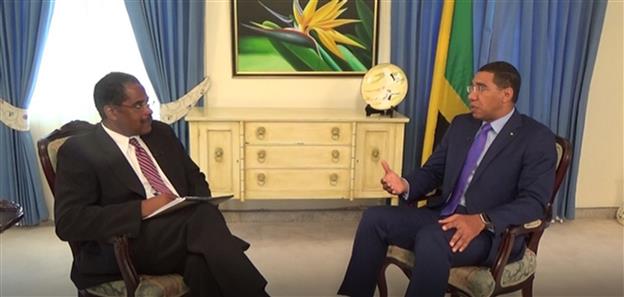 Prime Minister the Most Hon. Andrew Holness (right), elaborates on plans to harness the power of the diaspora, during a 30-minute interview with host of the Jamaica Diaspora Show, Mark Milward, on January 28.