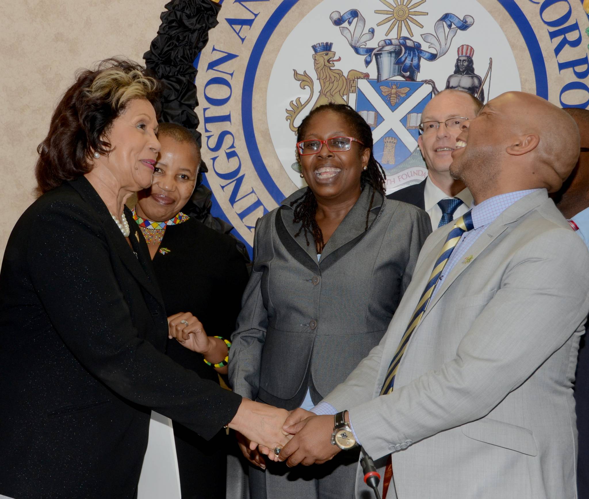 Custos Rotulorum of St. Andrew, Marigold Harding (left), shares a light moment with Executive Mayor of the City of Tshwane in South Africa, Councillor Kgosientso Ramokgopa (right), during the launch of the Kingston and St. Andrew Corporation’s (KSAC) inaugural Civic and Community Awards, at the Council’s offices, Church Street, downtown Kingston, on November 4. Also sharing the occasion were: South African High Commissioner to Jamaica, Her Excellency, Mathu Joyini (2nd left); Kingston’s Mayor, Senator Councillor Angela Brown Burke (centre); and members of Councillor Ramokgopa’s delegation.