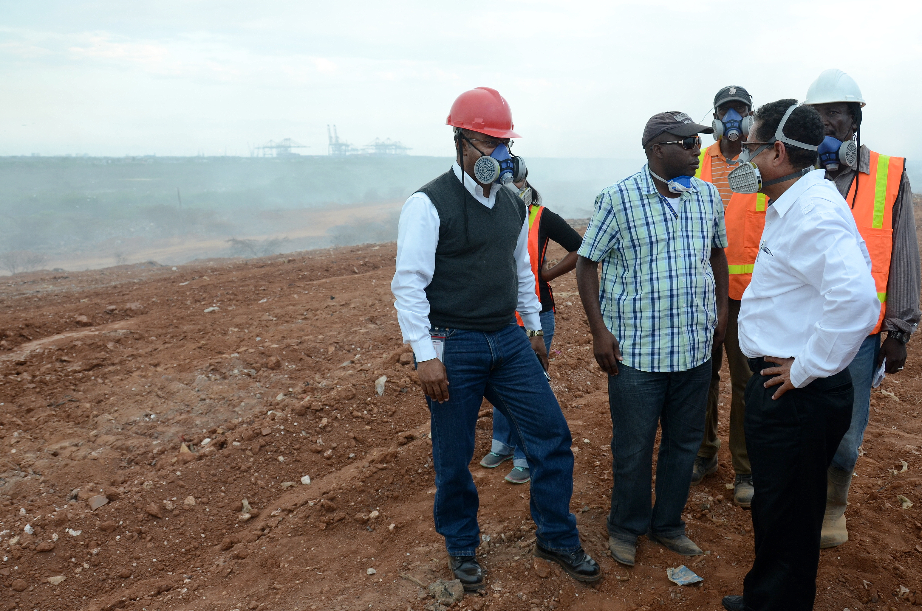 Minister of Local Government and Community Development, Hon. Noel Arscott (right), along with (from left):  Director-General of the Office of Disaster Preparedness and Emergency Management, Major Clive Davis; Regional Operations Manager, Metropolitan Parks and Markets, Adrian Grant, and Supervisor, Riverton City Disposal Site,  Larel Thomas observe the work being done to extinguish the fire at the Riverton City disposal site, during a tour of the facility on Friday, March 20.