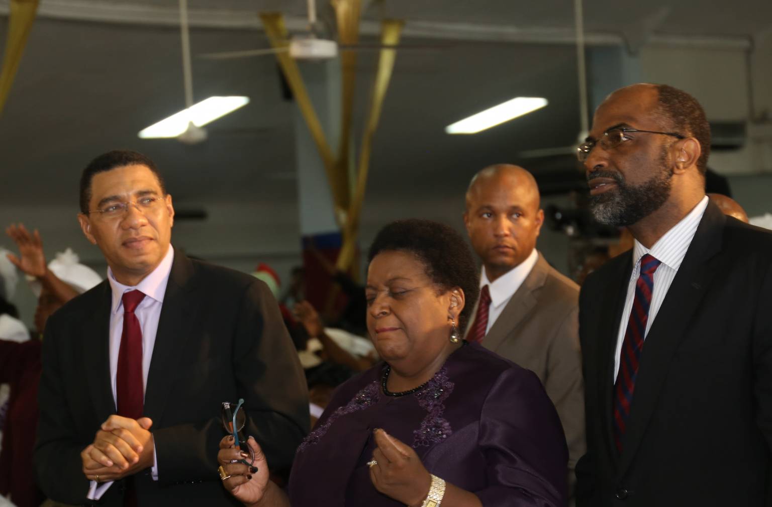 Prime Minister the Most Hon. Andrew Holness (left), participates in the 40th anniversary ceremony of the Deliverance Evangelistic Association, held on March 20 at the church’s location on Waltham Park Road, Kingston. Others from (2nd left) are Political Ombudsman, Donna Parchment Brown; and General Manager of Jamaica National, Earl Jarrett