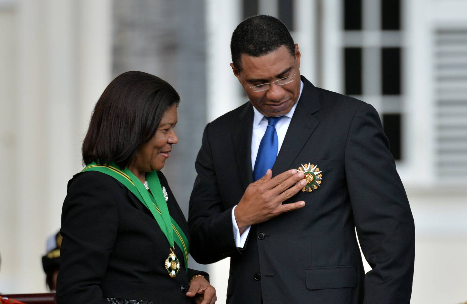 Prime Minister, the Most Hon. Andrew Holness, is affixed with the insignia of the Order of the Nation (ON), by Chief Justice and Chancellor of the ON, Hon. Zaila McCalla, during Thursday’s (March 3) swearing in ceremony at King’s House.