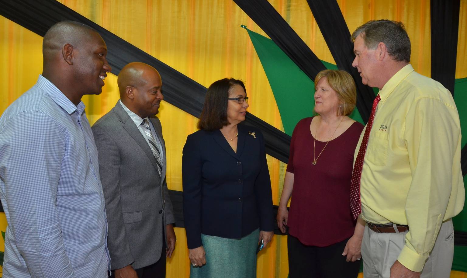 Caption: Minister of Labour and Social Security,  Hon. Shahine Robinson (centre), in discussion with Managers at Gebbers Farms in Washington, United States, Catherine Grandy (second right) and Bob Grandy (right), after the Gebbers Farms management and workers academic grants presentation ceremony  on May 5 at the Ministry’s North Street office. Listening are Supervisor at Gebbers Farms, Eyon Gayle (left) and Liaison Officer, Sheldon Brown.