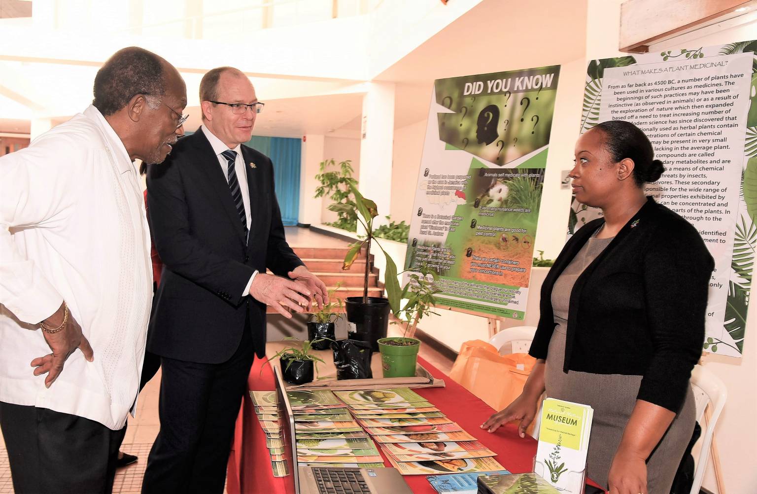 Director General at the National Commission on Science and Technology (NCST), Professor Errol Morrison (left) observes a discussion between Charge D’Affaires, South African High Commission, Phillip Riley (centre) and Education Outreach Officer, Natural History Museum, Institute of Jamaica, Eartha Cole, at the NCST Symposium held on November 30 at the Jamaica Conference Centre in Kingston.