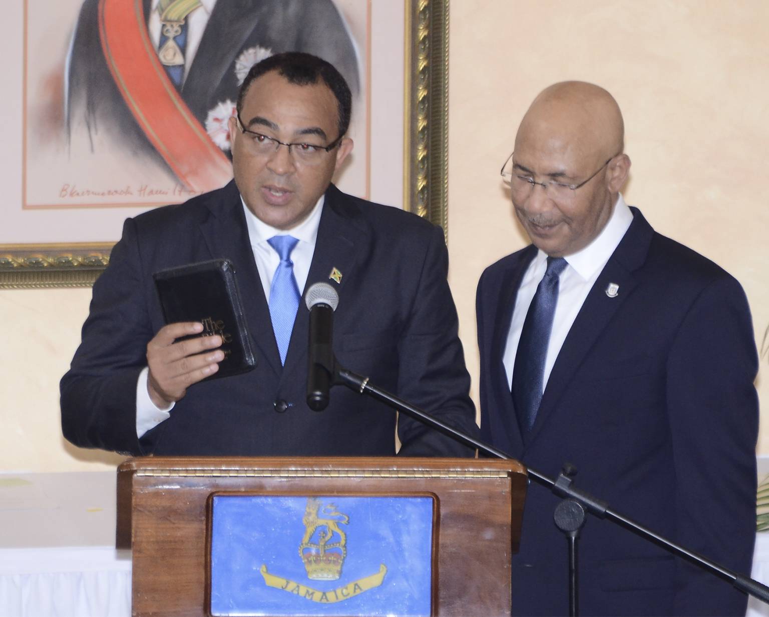 Governor General Sir Patrick Allen looks on as Dr. Hon. Christopher Tufton is sworn in as Minister of Health.