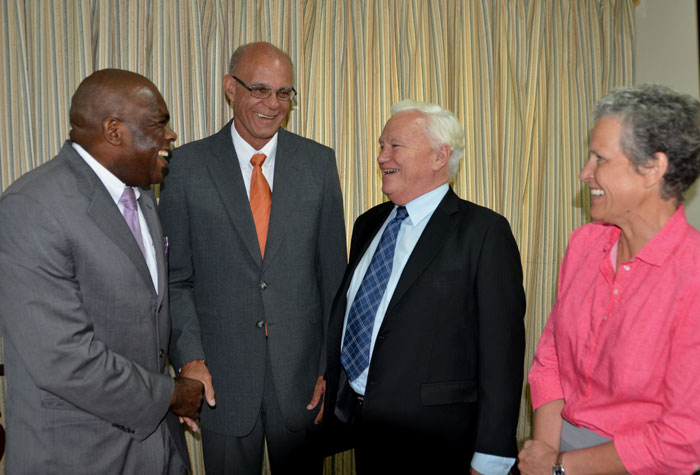 President of the Senate, Hon. Floyd Morris (left), shares  a light moment with (from 2nd left): Speaker of the House of Representatives, Hon. Michael Peart; Asian Development Bank (ADB) Representative, Hon. Richard Prebble; and Pacific Private Sector Development Specialist, Laure Darcy, prior to the start of a meeting between members of Parliament’s Public Administration and Appropriations Committee and the visiting ADB delegation, at Gordon House, on Tuesday (July 21). The meeting formed part of the four-day itinerary for the delegation’s visit from July 20 to 23.