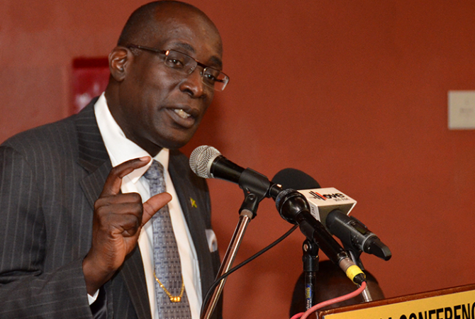 Education, Youth and Information Minister, Senator the Hon. Ruel Reid, emphasizes a point during a press briefing at the Jamaica Conference Centre in downtown Kingston on Friday, May 6, following the Ministry’s consultations with high school board chairpersons, principals and bursars on the Government’s proposed tuition fee policy at that venue.
