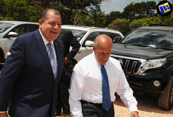 
Minister of Finance and the Public Service, Hon. Audley Shaw (left),  with Blue Mountain Renewables (BMR) President, Bruce Levy,  at the opening of the company’s wind farm at Potsdam, in St. Elizabeth,  on August 11.
