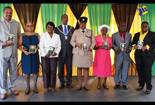 Mayor of Montego Bay, Councillor Glendon Harris (4th left) stands with the seven recipients of the 2016 Sam Sharpe Awardees, following the National Heroes Day Salute, Civic and Awards Ceremony, held in Sam Sharpe Square in Montego Bay on October 17. The awardees from left are: Educator, Irvin Atkinson; Mirriam Williams of the Western Mirror; Hotelier Doris Morgan; Deputy Superintendent of Police, Mercedes Curry; Centenarian and former Nurse, Iris Denniston; Educator Vivian Douglas; and Football Coach, Tracy Reid.