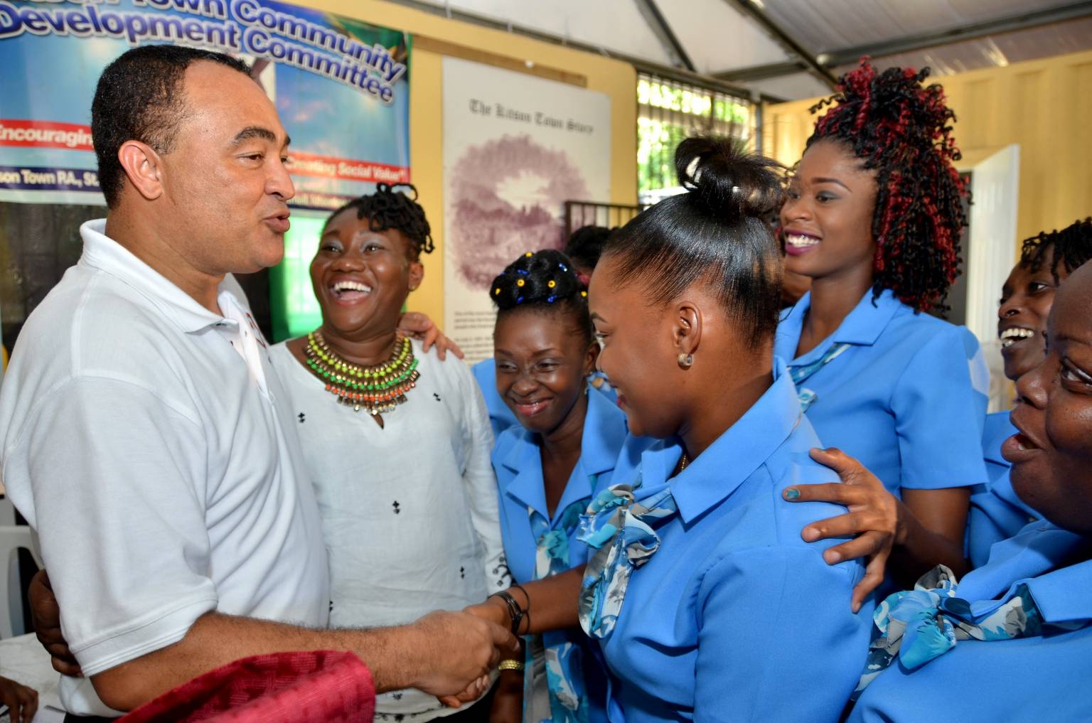 Health Minister and West Central St. Catherine Member of Parliament,  Dr. the Hon. Christopher Tufton (left), interacts with Early Childhood Instructor for the training programme for unattached youth, Arlene Brown (2nd left), and students during the initiative’s recent launch at the Kitson Town community resource centre.