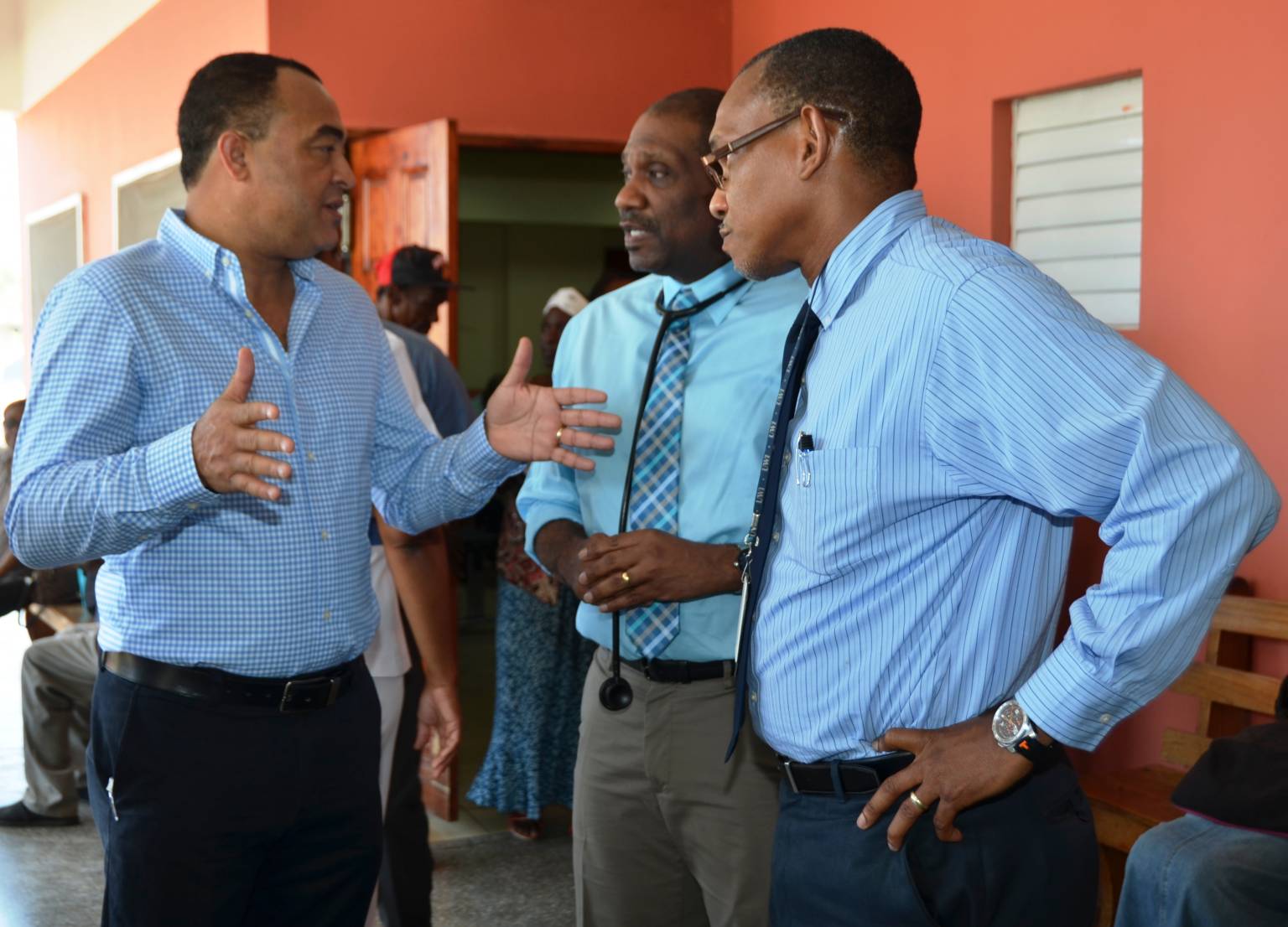 Minister of Health, Dr. the Hon. Christopher Tufton (left),  in conversation with Head of the Department of Internal Medicine and consultant nephrologist, Dr. Curtis Yeats (centre) and Chief Executive Officer, Anthony Smikle, during a tour of the medical records department  of the  Cornwall Regional Hospital, in Montego Bay, on April 28. 