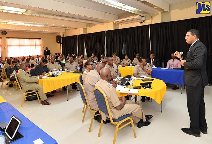 Prime Minister, the Most Hon. Andrew Holness (right), addresses senior members of the Jamaica Constabulary Force (JCF) at a special meeting held at the Police Officers’ Club in Kingston on August 23.
