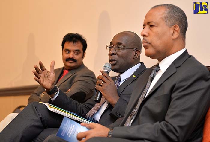 Minister of Education, Youth and Information, Senator the Hon. Ruel Reid (centre), responding to questions during a forum on March 27 at The Jamaica Pegasus hotel, to engage stakeholders in the education sector on how to align programmes to meet the labour force needs to expand the business process outsourcing (BPO) sector. He is joined by  President of the Business Process Industry Association of Jamaica, Dr. Guna Muppuri (left) and  President and CEO of the Port Authority of Jamaica, Professor Gordon Shirley.