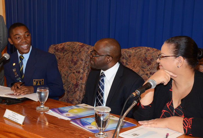 Minister with responsibility for Information, Senator the Hon. Sandrea Falconer (right); and Director, Access to Information (ATI) Unit, Office of the Prime Minister (OPM), Damian Cox (centre); listen to a point being made by second place winner of the 2012/13 Access to Information Essay Competition, Kerron White; during the launch of this year’s competition on September 24. The competition open to registered high school students between third and sixth forms, who are being asked to write on the topic: ‘The Access to Information Act (2002) is critical for enabling citizens to exercise their voice, to effectively monitor and hold government accountable, and to enter into informed dialogue about decisions which affect their lives. Discuss.”