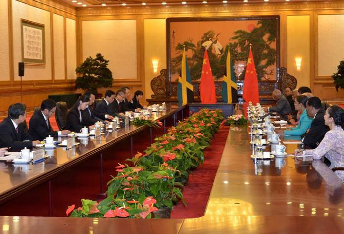 Prime Minister, the Most Hon. Portia Simpson Miller (fourth left), at a meeting with President of the People’s Republic of China, His Excellency Xi Jinping (fourth right), in Beijing August 22. The Prime Minister is on a five-day official visit to China. To the Prime Minister’s right are: Minister of Foreign Affairs and Foreign Trade, Senator the Hon. A. J. Nicholson; Ambassador to China, Mr. Ralph Thomas and Dr. Carlton Davis, Special Adviser to the Prime Minister.