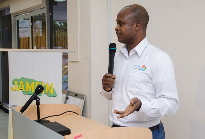 Founder of Branditise.com, Mr. Wayne Marsh, making a presentation about his products to persons from the micro-finance industry, at a quarterly meeting of the Jamaica Association of Micro-Financing (JAMFIN), on July 22, at the New Kingston offices of the Ministry of Industry, Investment and Commerce.