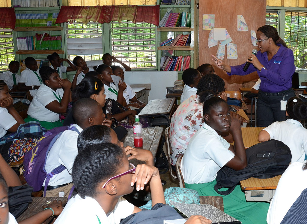 Minister of Education, Hon. Rev. Ronald Thwaites (left) and General Manager, Strategic Planning and Corporate Affairs, First Heritage Co-operative Credit Union (FHCCU), Maria Morrison (centre), sign Memorandum of Understanding (MOU) for the annual parenting seminar at the agency’s offices at 10 East Avenue in Kingston, on May 22. At right is Assistant General Manager, Marketing and Communications, FHCCU, Juven Montague Anderson. This year’s seminar will be held on Monday, May 27 at the Knutsford Court Hotel in Kingston and is slated to begin at 4:00 p.m.