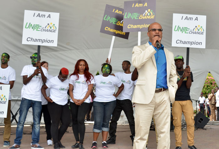 Minister of National Security, Hon. Peter Bunting (foreground); addressing students, teachers and other stakeholders at Emancipation Park in St. Andrew on Tuesday, March 4, during in the inaugural staging of the National Safe Schools’ Peace Day concert. The event was held to launch ‘Peace Month’ to be observed during March under the theme:  “Champions of Peace. It is an initiative of the Ministry of National Security, under its ‘Unite for Change’ public education and behaviour change programme aimed at tackling the nation’s crime problem.
