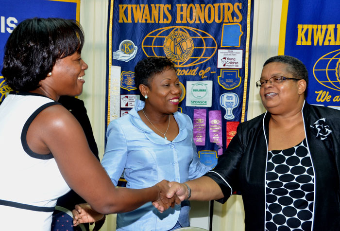 Permanent Secretary in the Ministry of Justice and Chair of the National Task Force Against Trafficking in Persons, Carol Palmer (right), is introduced to Secretary for the Kiwanis Club of New Kingston, Sacha Vacianna Riley (left), by Club President, Rosemarie Henry, prior to the start of  a human trafficking seminar, hosted by the Club on July 16, at the offices of the Institute of Chartered Accountants of Jamaica in Kingston.