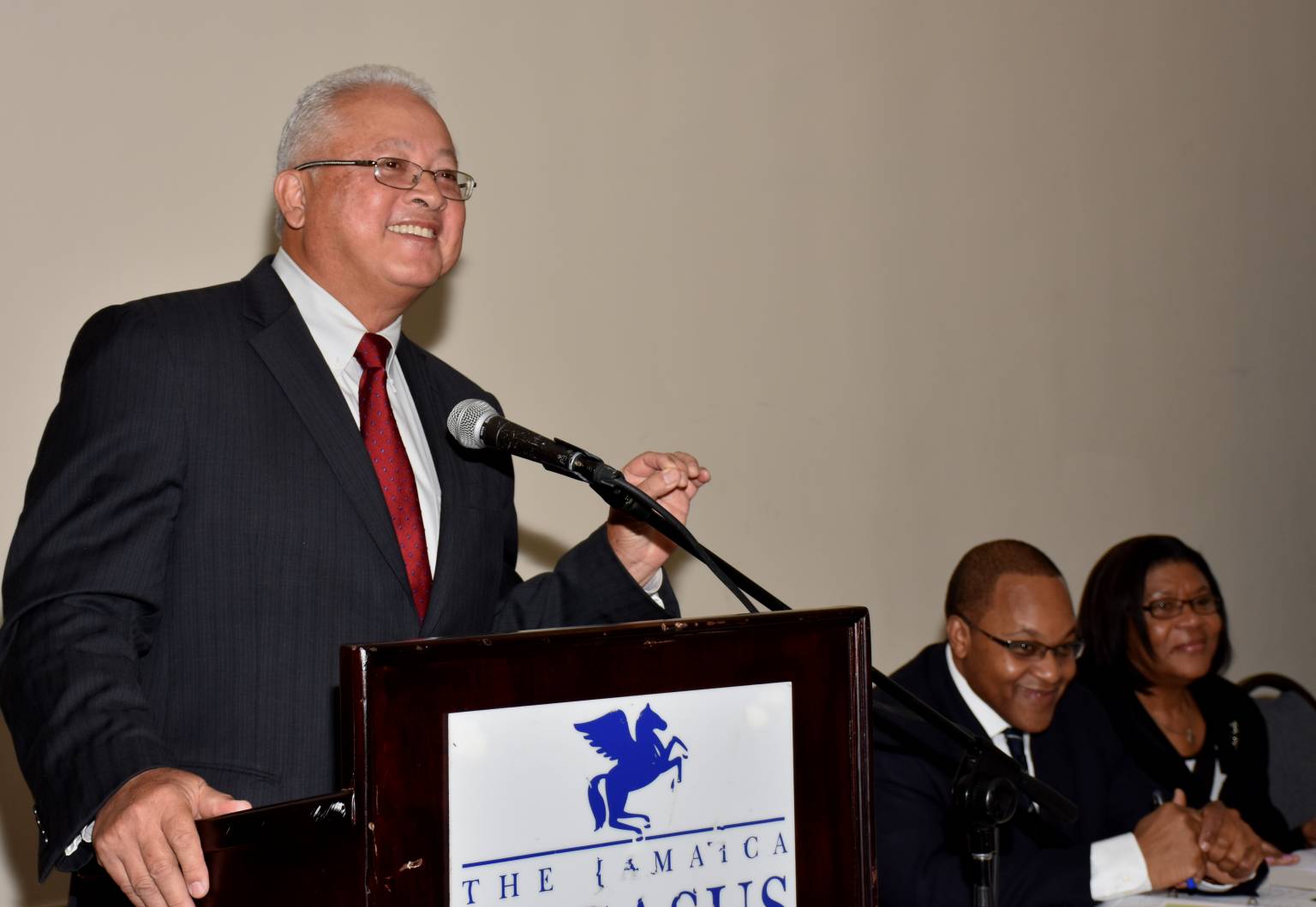 Justice Minister, Hon. Delroy Chuck (left), makes his presentation at a forum on the Justice Undertakings for Social Transformation (JUST) Programme, held recently, at the Pegasus Hotel in New Kingston. Seated at the head table are Ontario Court of Appeal Judge, Justice Michael Tulloch (2nd left), and Chief Justice, Zaila McCalla. 
