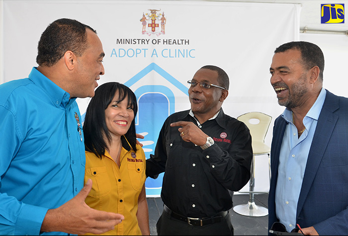 Health Minister, Dr. the Hon. Christopher Tufton (left), shares a joke with Group President and Chief Executive Officer (CEO) of the Victoria Mutual Building Society (VMBS), Courtney Campbell (2nd right), at the official launch of the Health Ministry’s ‘Adopt-a-Clinic’ initiative at the St. Jago Health Centre in Spanish Town, St. Catherine, on November 7. Others sharing in the moment are: VMBS Group Chief Corporate Affairs and Communications Officer, Vivienne Bayley-Hay; and Chief Medical Officer (CMO), Dr. Winston De La Haye. 