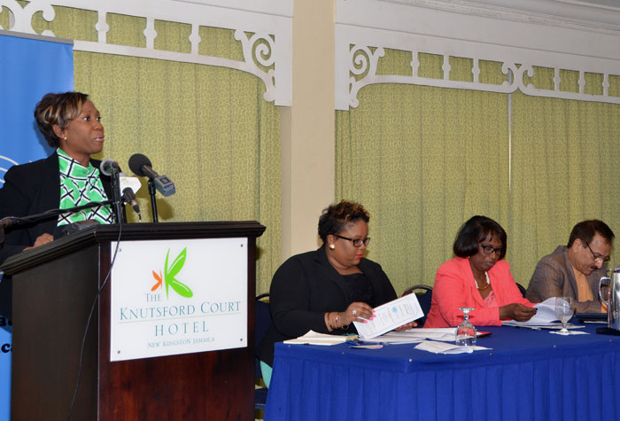 Children’s Advocate, Diahann Gordon-Harrison (at the podium), addressing a forum, hosted by the United Nations office in Jamaica, at the Knutsford Court Hotel, New Kingston on October 10, to commemorate International Day of the Girl Child 2014. The day was officially observed on October 11, under the theme: ‘Empowering Adolescent Girls, Ending the Cycle of Violence’. Also participating, at the head table, were, from left: Executive Director, Jamaica Youth Advocacy Network, Monique Long; Director, United Nations Population Fund (UNFPA), Sheila Roseau; United Nations Resident Coordinator in Jamaica, Dr. Arun Kashyap; and Executive Director, National Family Planning Board, Dr. Denise Chevannes-Vogel.