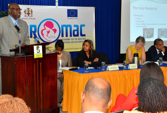Minister of Health, Hon. Dr. Fenton Ferguson (at podium), addressing the recent official launch of the Programme for the Reduction of Maternal and Child Mortality (PROMAC), held at the Planning Institute of Jamaica (PIOJ), in Kingston. Others (from left) are:  Deputy Director General of the PIOJ, Barbara Scott; Deputy Dean at the UWI Faculty of Medical Sciences, Professor Minerva Thame; Head of the European Union (EU) in  Jamaica, Ambassador Paola Amadei, and Director General of the PIOJ, Colin Bullock.

