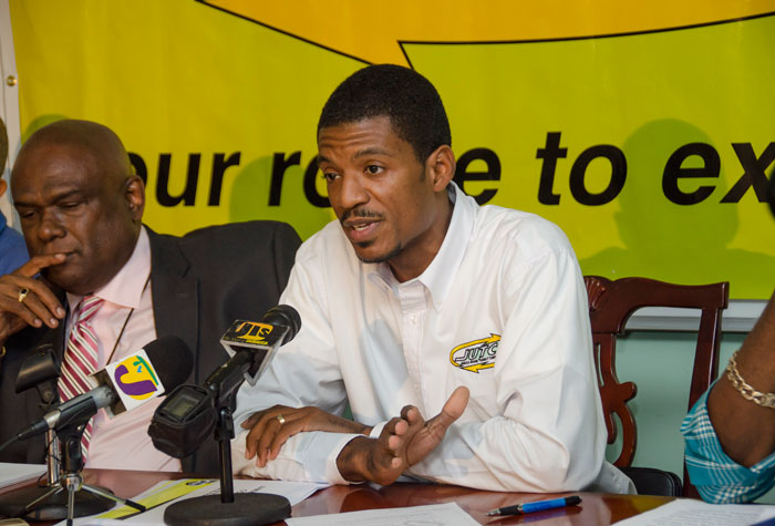 Deputy Managing Director in charge of Operations, Jamaica Urban Transit Company (JUTC), Kirk Finnikin (right), addresses journalists during a press briefing held at the JUTC’s Twickenham Park headquarters offices, on April 1. Also pictured is: Managing Director of the JUTC, Colin Campbell. 
