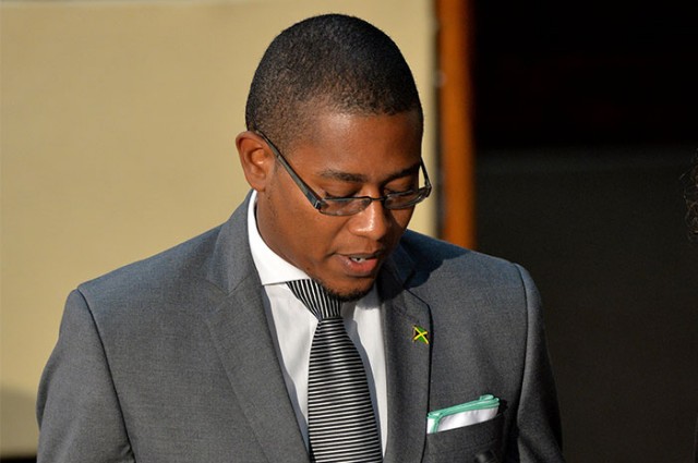 State Minister in the Ministry of Education, Youth and Information, Hon. Floyd Green, takes the Oath of Office during the swearing in ceremony for Parliamentarians on Thursday, March 10, at Gordon House, in downtown Kingston.