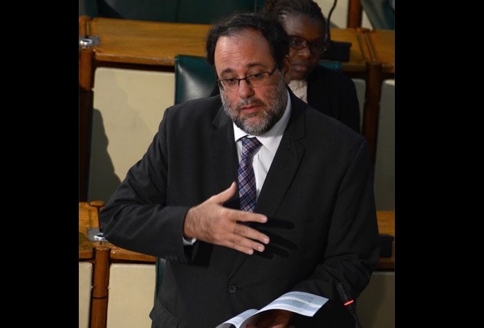 Government Senator and Minister of Justice, Hon. Mark Golding, highlights a point while piloting the Bankruptcy and Insolvency Bill in the Senate on October 16.  The Bill was passed.