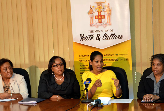Minister of Youth and Culture, Hon. Lisa Hanna (3rd left), speaking at a press briefing, held on April 8, at the Ministry in St. Andrew, where she presented a report on child abuse.  Others (from left) are: Senior Advisor to Minister Hanna, Mrs. Sadie Keating; Chief Executive Officer of the Child Development Agency (CDA), Mrs. Rosalee Gage-Grey, and Acting Permanent Secretary in the Ministry, Mrs. Sherrill O’Reggio-Angus.   