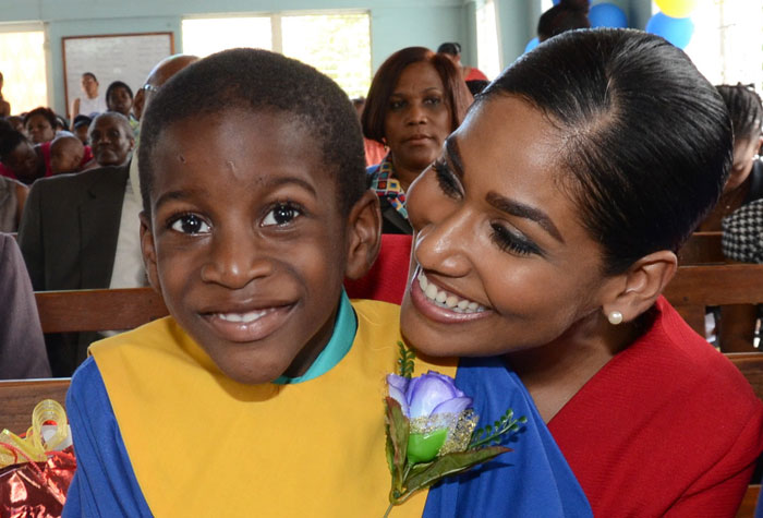Minister of Youth and Culture, Hon. Lisa Hanna, congratulates an excited Jodane Martin, for being the valedictorian for the 2014 graduating class of the Ministry of Labour and Social Security’s Early Stimulation Programme (ESP). Minister Hanna was the guest speaker at the ceremony, which was held on July 30, at the Apostolic Church of Jamaica, in Kingston.
