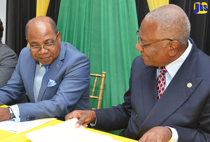 Minister of Tourism, Hon. Edmund Bartlett (left), in discussion with Chairman, Tourism Enhancement Fund, Godfrey Dyer, during the press launch of a revitalised ‘Spruce Up Jamaica’ initiative, at the Devonshire, Devon House, St. Andrew, yesterday (Jan. 24). Spruce Up Jamaica is the Ministry’s flagship umbrella programme which will encapsulate various initiatives primarily geared at changing attitudes and creating integration among industries and programmes that impact the tourism sector.
 
