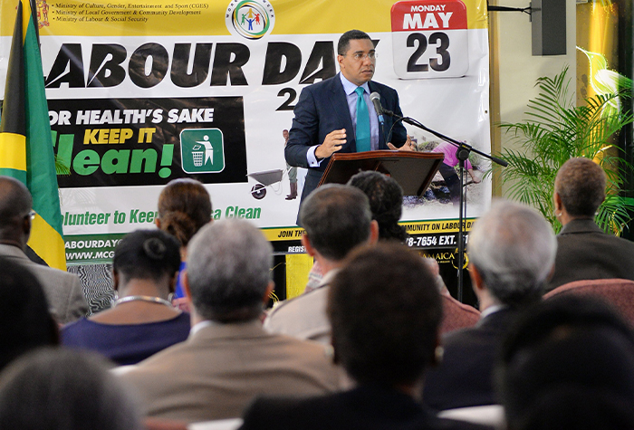 Prime Minister, the Most Hon. Andrew Holness (at podium), addresses the launch of National Workers’ Week and Labour Day, at the Office of the Prime Minister on May 6. National Workers’ Week will be observed from May 15 to 23 under the theme: ‘For Health’s Sake, Keep It Clean’.