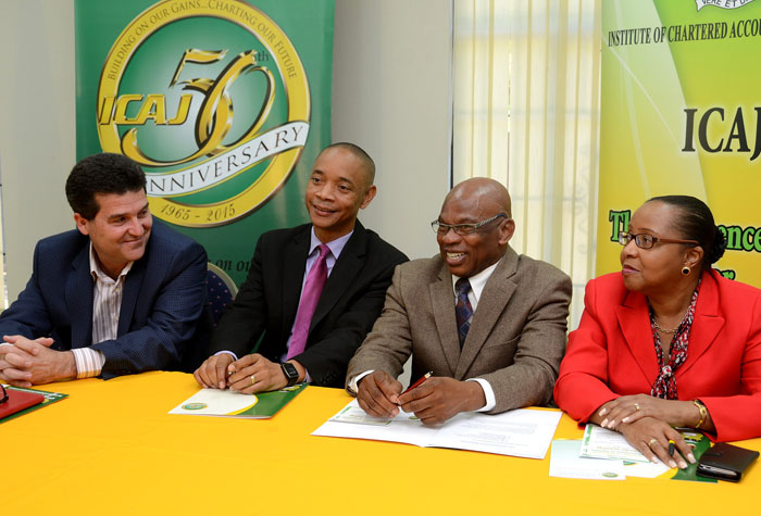 President of the Private Sector Organization of Jamaica (PSOJ), William Mahfood (left), shares a light moment with (from second left), President of the Institute of Chartered Accountants of Jamaica (ICAJ), Dennis Chung;  Chairman of the ICAJ’s 50th anniversary committee, Dennis Brown,  and Executive Director of the ICAJ, Mrs. Rosemarie Heaven. Occasion was a media briefing on February 9, in Kingston,  to announce activities planned to celebrate the ICAJ’s 50th anniversary.