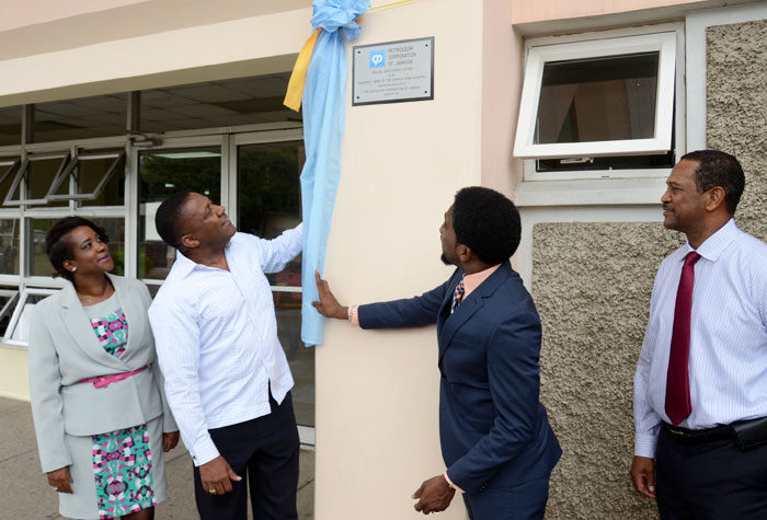 Science, Technology, Energy, and Mining Minister, Hon. Phillip Paulwell (2nd left), is assisted by South East Regional Health Authority (SERH) Chairman, Dr. Andrei Cooke, to unveil a commemorative plaque marking Wednesday’s (July 15) official commissioning of air conditioning systems, valued $8.4 million, at the maternity unit of the Spanish Town Hospital in St. Catherine, by the Petroleum Corporation of Jamaica (PCJ). Sharing the occasion, from left, are: the Hospital’s Chief Executive Officer, Peta-Kaye Sinclair Hamilton; and PCJ Group General Manager, Winston Watson.