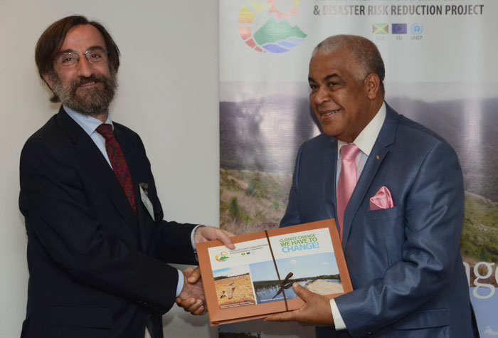 Minister of Water, Land, Environment and Climate Change, Hon. Robert Pickersgill (right), presents Head of Cooperation for the European Union (EU) Delegation in Jamaica, Jesús Orús Báguena, with a Climate Change Audio-Visual Tool Kit, during a ceremony at the Ministry’s New Kingston offices on May 28.