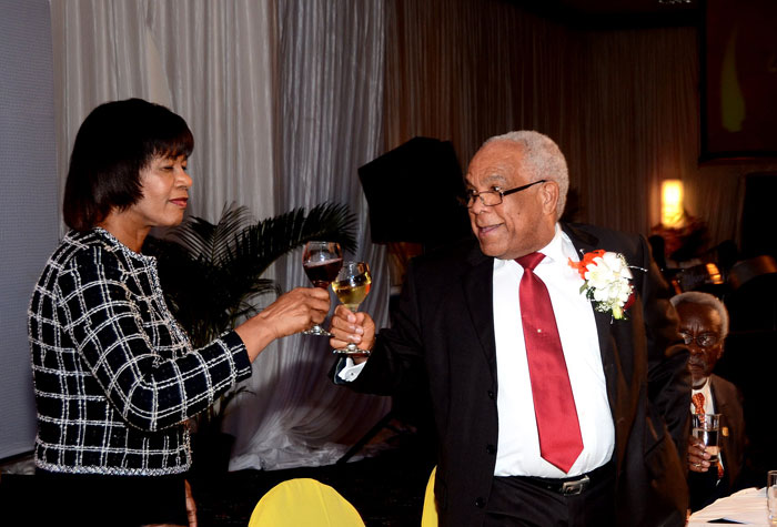 Prime Minister, the Most Hon. Portia Simpson Miller (left), raises a toast to Minister of Transport, Works and Housing, Dr. the Hon. Omar Davies (centre), while former Prime Minister, the Most Hon. PJ Patterson (right), looks on. Occasion was a special ceremony held on February 7 at the Jamaica Pegasus Hotel, in New Kingston, in honour of Dr. Davies for his 21 years as Member of Parliament for South St. Andrew.