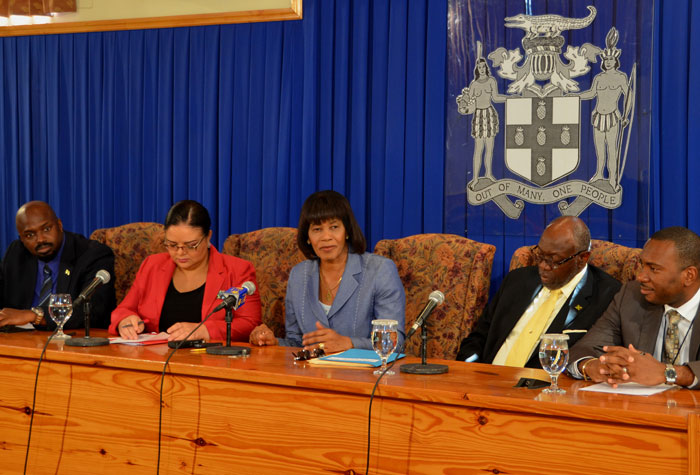 Prime Minister, the Most. Hon. Portia Simpson Miller (centre), addresses a press briefing held at the Office of the Prime Minister on October 9, to give an update on the national health emergency response. Others (from left) are: Acting Director General, Office of Disaster Preparedness and Emergency Management, Richard Thompson; Information Minister, Senator Hon. Sandrea Falconer; Minister of Health, Hon. Dr. Fenton Ferguson; and Acting Permanent Secretary in the Ministry of Health, Dr. Kevin Harvey (left).

